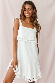 Perfect for your next warm weather vacay, our chic Sirocco dress features tied shoulder straps, tassel trim embellishment and a fluted hem. Team it with our some canvas wedges and a head scarf or throw on some sandals for a day at the beach. Dreamy! Looks Hippie, Hot Party Dresses, Selfie Leslie, Yellow Bridesmaids, Blue Bridesmaids, Clothing Tags, Date Night Dresses, Mini Dress Casual, Day At The Beach