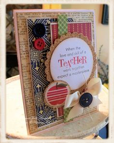 a close up of a card on a table with buttons and ribbon attached to it