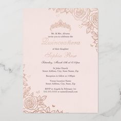 a pink and gold wedding card with roses on the front, in white marble background