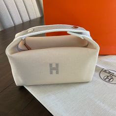 Brand New Never Used, Perfect Condition Hermes Bride-A-Brac Case! **2 Available** Super Rare & Exclusive Color 100% Authentic Purchased Directly From The Store In 2024. Brand New Bride A Brac Travel Case Natural Cream Pm Size. Condition: Pristine, Brand New, Never Used. Includes Original Packaging (Dust Bag And Shopping Bag). Color: Naturel Size: Small Model - 100% Cotton- Anti-Stain Lining In Herringbone Canvas- Embroidered "H" On The Front- Three Interior Pocketsincludes A Handle For Hanging T Hermes Bride A Brac, Hermes Travel Bag, 2025 Wishlist, Canvas Sling Bag, New Bride, Vintage Hermes, Natural Cream, Bag Packaging, Hermes Bags