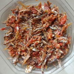 a glass bowl filled with lots of different types of food