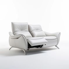 a white leather reclining chair with footrests and arm rests on the floor