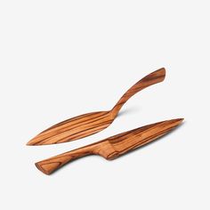 two wooden spoons sitting on top of each other