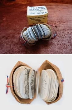 an open book sitting on top of a floor next to a cardboard box filled with books