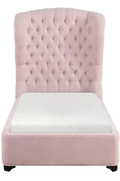 an upholstered bed with a white mattress and pink velvet headboard, viewed from the side