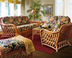 a living room filled with furniture and decor on top of a hard wood floored floor