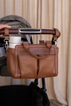 amelia pram caddy install in pram's handle bar Mom Bag, Nappy Bags, Car Caddy For Baby, Leather Nappy Bag, Pram Accessories, Baby Bags For Mom, Baby Nappy Bags, Cute Diaper Bags