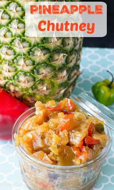 pineapple chutney in a glass bowl next to a pineapple