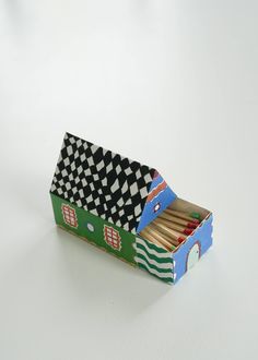 an open matchbox with matches in it