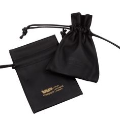 a black pouch with the word wp on it and an embroidered logo in gold