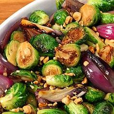 brussel sprouts, brussels sprouts and onions in a white bowl