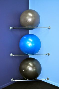 there are three balls that are on the wall