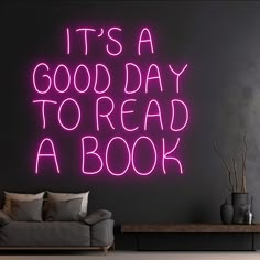 it's a good day to read a book neon sign in a living room