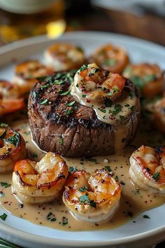 a steak and shrimp dish on a white plate