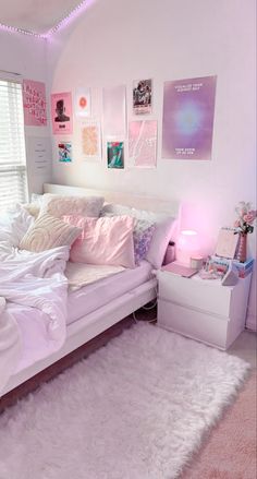 a white bed sitting in a bedroom on top of a pink carpeted floor next to a window