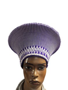 This is the perfect hat for your occasions. The Zulu Basket Hat-No Beading is made of hand-woven natural fibers with a reinforced brim to ensure long-lasting wear. Its classic Zulu shape and style make it a timeless choice that will never go out of style. With no added beading, this hat offers a clean look and bold sophistication. Is a Traditional South African headpiece that is curated from South Africa To get the right fit, measure the circumference of your head African Headpiece, Zulu Hat, Basket Hat, Zulu, Purple And White, South African, Go Out, Natural Fibers, Out Of Style