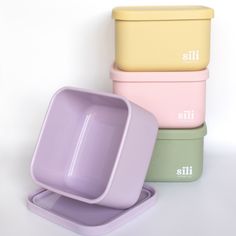 three pastel colored dishes stacked on top of each other with the words lita in white