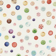 a white background with many different colored buttons on the wall and in the center, there is a small amount of smaller colorful buttons that are scattered around it