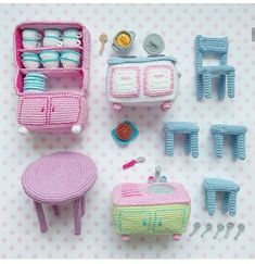 crocheted furniture and accessories are displayed on a table with pink polka dot background