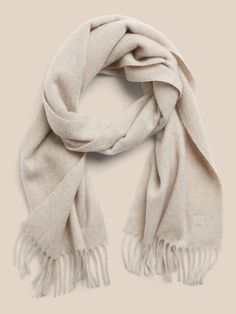 Spun from pure cashmere, this soft and warm scarf will be the one you reach for on cold days for seasons to come.  Length: 63" (160cm) Width: 12" (30. 5cm) Classic Beige Scarf For Fall, Classic Beige Scarves For Fall, Classic Wool Scarves For Cold Weather, Beige Cashmere Scarves For Fall, Classic Scarves For Cold Weather In Fall, Classic Scarves For Fall And Cold Weather, Elegant Wool Scarves For Cold Weather, Classic Cashmere Scarves, Classic Beige Shawl For Winter