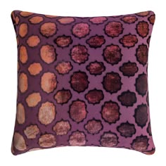 a purple pillow with brown spots on it