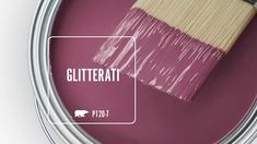 a paint can with a brush in it and the word glitteratt on top of it