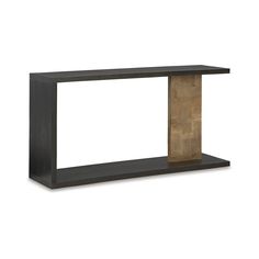 a black and wood shelf sitting on top of a white wall