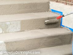 someone is painting the steps with blue paint