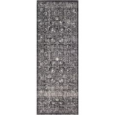 a black and white rug with an ornate design on the bottom, in front of a white background