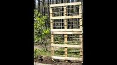 a tall wooden structure sitting in the middle of a forest