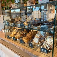 a display case filled with lots of different types of pastries