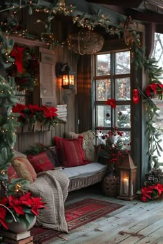 a porch decorated for christmas with poinsettis, greenery and lights on the windowsill