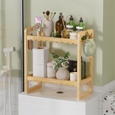 a wooden shelf filled with bathroom items next to a shower