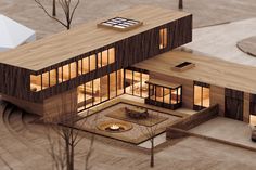 an aerial view of a modern house with wood sidings and glass windows at night