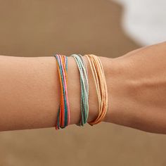 It’s the bracelet that started it all. Each one is handmade, waterproof and totally unique—in fact, the more you wear it, the cooler it looks. Grab yours today to feel the Pura Vida vibes. 100% waterproof Wax-coated Adjustable from 2-5 inches in diameter Pura Vida supports artisans worldwide Seasonal Pillows, Watermelon And Lemon, Pura Vida Bracelets, Food Accessories, Hair Accessories Gift, Pinky Promise, Take A Shower, Personal Marketing, Vera Bradley Backpack