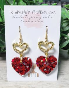 Red glitter dangle heart earrings. Made with lead and nickle free posts. Perfect Valentine's Day gift or accessory. Hang down about 1.5in from ear Will come gift-wrapped. Ships free. Multiple colors available. Heart-shaped Earrings For Mother's Day Party, Red Glitter Jewelry For Party, Mother's Day Heart Earrings For Party, Mother's Day Double Heart Earrings For Party, Handmade Heart Earrings For Valentine's Day Gift, Red Dangle Heart Earrings For Gift, Nickel Free Earrings For Valentine's Day, Red Heart-shaped Earrings For Her, Red Dangle Heart Earrings As A Gift