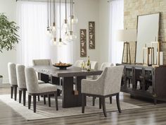 a dining room table with chairs and a bowl of food on it