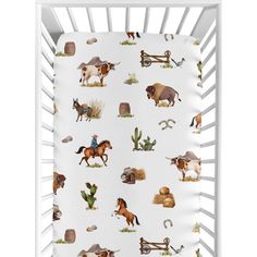 a baby crib with horses and other animals on it