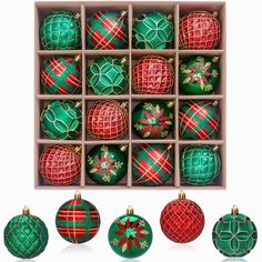 twelve christmas ornaments in an open box on a white background, including green and red balls