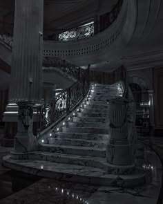 a large staircase in a building with lights on the sides and marble steps leading up to it