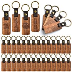 wooden keychains with black leather handles are shown in front of a white background