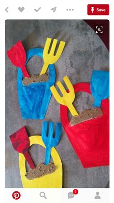 some colorful plastic utensils and sand on a table