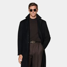 A sophisticated black overcoat, tailored to a knee length. Featuring a single-breasted closure, hidden buttons, and welted pockets. This design includes raglan sleeves, a detachable belt, and a single vent for refined style. Formal Solid Color Long Wool Coat, Formal Black Pea Coat With Concealed Placket, Black Formal Pea Coat With Concealed Placket, Black Pea Coat With Hidden Buttons For Business Casual, Luxury Black Pea Coat With Notch Lapel, Formal Black Single Breasted Wool Coat, Modern Long Sleeve Wool Coat For Formal Occasions, Elegant Black Wool Coat With Concealed Placket, Business Casual Black Pea Coat With Hidden Buttons