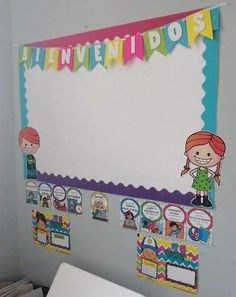 a bulletin board is hanging on the wall in a child's room with pictures