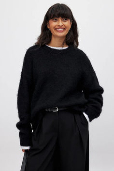 Wool Blend Oversized Sweater Soft Knit Crew Neck Sweater For Work, Black Crew Neck Sweater For Work, Oversized Black Workwear Sweater, Oversized Black Sweater For Work, Black Oversized Textured Knit Sweater, Chic Black Sweater With Relaxed Fit, Chic Black Relaxed Fit Sweater, Black Soft Knit Crew Neck Sweater, Relaxed Fit Black Ribbed Sweater