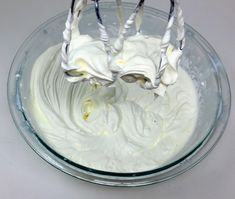 a bowl filled with whipped cream on top of a table