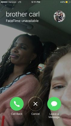 two women sitting in the back seat of a car