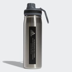 a stainless steel water bottle with a black label on the side and a gray lid