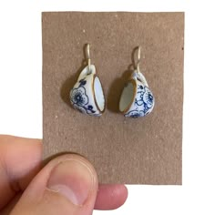 You will love these Cute Blue Floral Ceramic Earrings, 2cm high little ceramic teacups with blue flowers and gold rim hang on handmade silver plated ear wires. Perfect little unique earrings for birthdays, or treats for yourself. Gorgeous little earrings that will get lots of attention and compliments. 𝗚𝗼𝗿𝗴𝗲𝗼𝘂𝘀 𝗠𝗮𝘁𝗰𝗵𝗶𝗻𝗴 𝗻𝗲𝗰𝗸𝗹𝗮𝗰𝗲: 𝗵𝘁𝘁𝗽𝘀://𝗲𝘁𝘀𝘆.𝗺𝗲/𝟯𝗫𝘆𝗝𝗵𝗪𝗿 ❤️ SIZE : approximately 2cm drop. ❤️ MATERIALS: ceramic teacup with blue flowers, handmade silver plated ear wires. ❤️ PROCESSING TIME : 1 business day. ❤️ You only pay postage on the 1st item,  everything else ships with it for FREE!  ❤️ PACKAGING  All orders come packaged in tissue paper with a pretty sticker. I do not use any plastic to wrap any products in order to protect our planet.  ❤️ CARING Earrings Weird, Tea Drinker Gifts, Weird Earrings, Novelty Earrings, Funny Earrings, Quirky Earrings, Ceramic Earrings, Tea Lovers Gift, Ceramic Earring