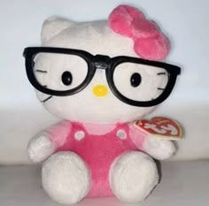 a hello kitty stuffed animal wearing glasses